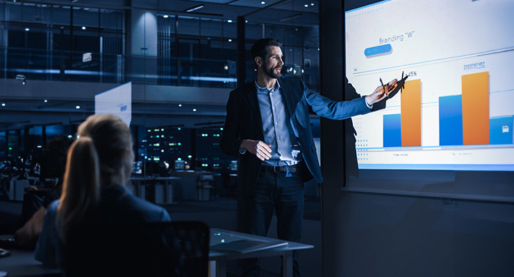 A man presenting a report to colleagues