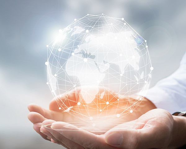 Businessman holding in hand with global connection concept.