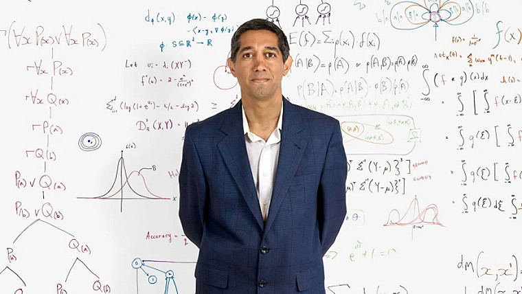 Babak Hodjat with a wall full of formulas