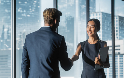 A banking official shaking hands with a customer