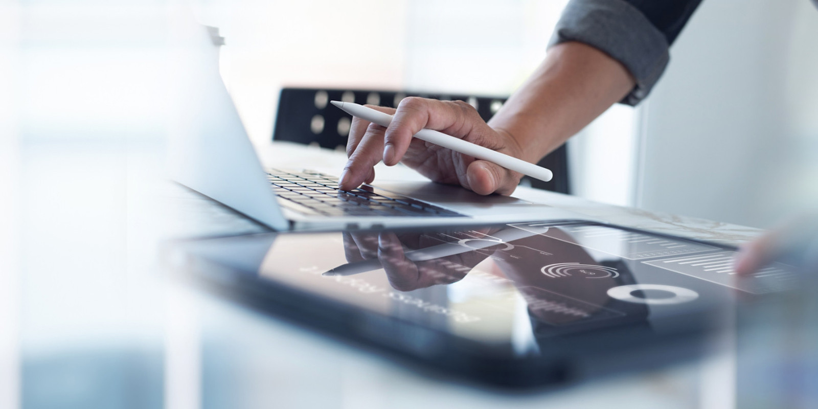 associate working on multiple devices