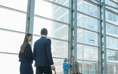 Two people walking in a corporate area