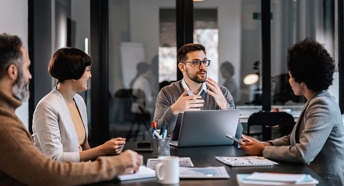 Group of people sitting in a discussion room
