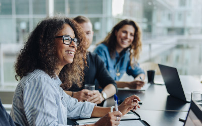 Smiling colleagues in a meeting at workplace