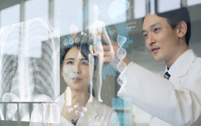 Doctors inspecting scan on a digital screen