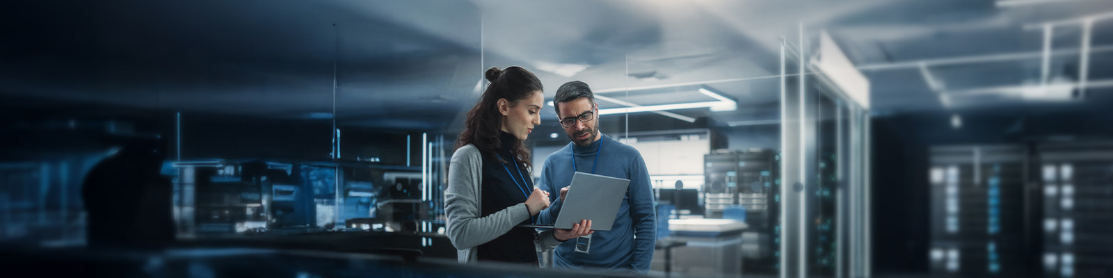 two people looking at laptop
