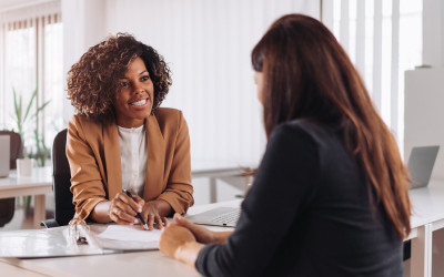 A woman making a digital payment holding a bank card