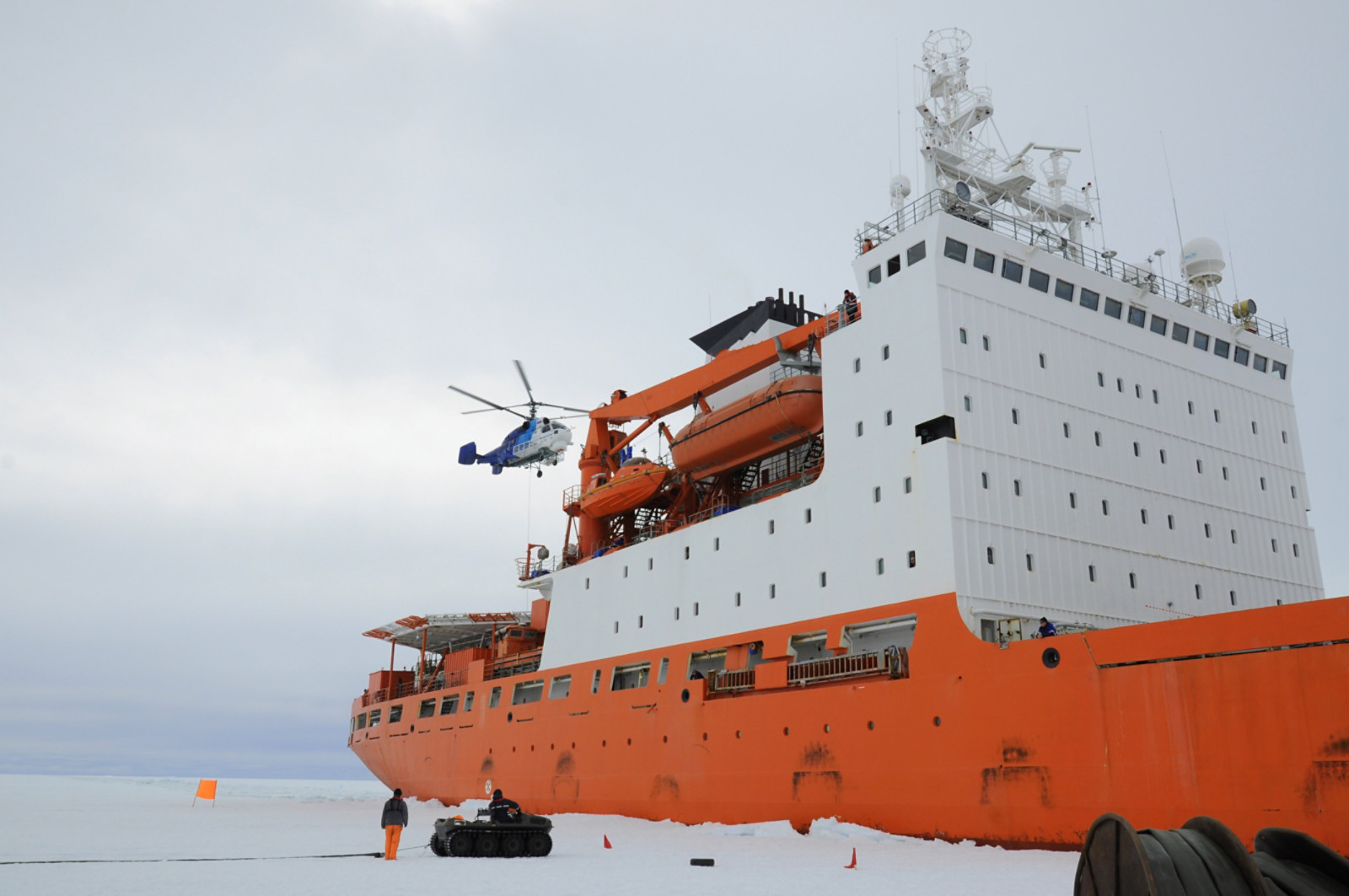 Cargo ship arrives in port for unloading on an ice floe. Antarctic.