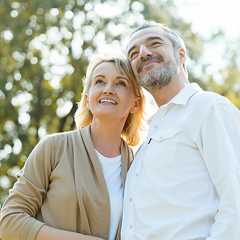 Man and woman looking above