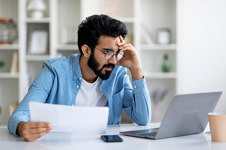 A man watching hi laptop