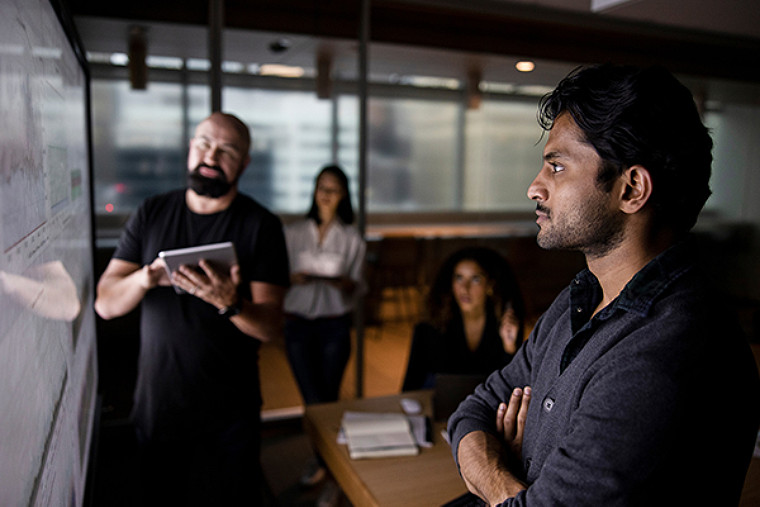 A group watching the board