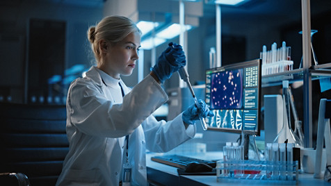 lab technician working with a test tube