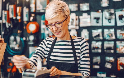 A lady printing receipt at a retail store