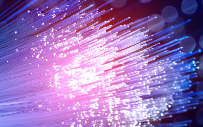 Glowing fiber optic cable displaying blue and purple lights