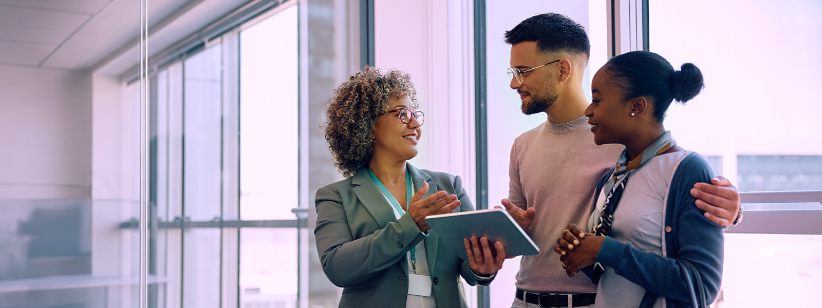 Warehouse worker checking inventory data on tablet among storage racks