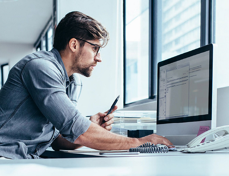 Associate looking at screen