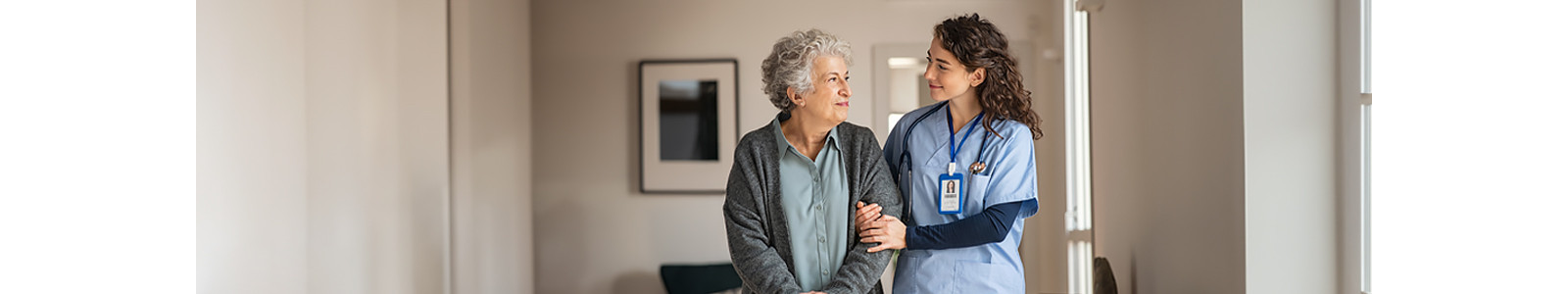 A caregiver holding an old person