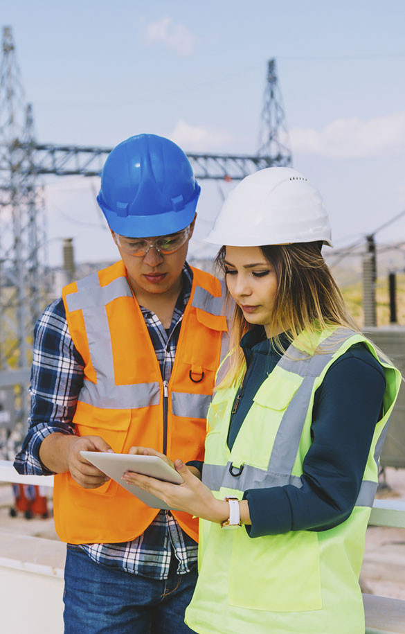 construction safety workers looking at laptop