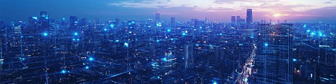 A cityscape illuminated by blue lights and tangled wires, creating a vibrant and electric nighttime atmosphere.