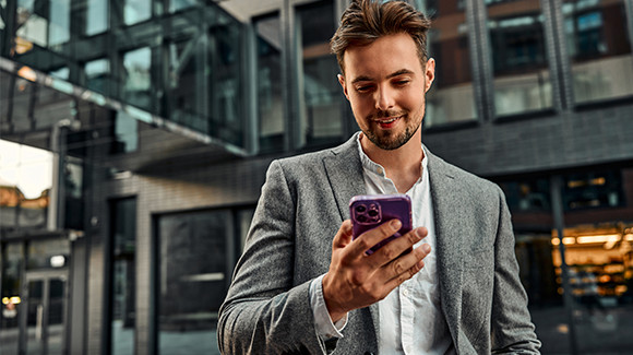 A man looking at his mobile device.