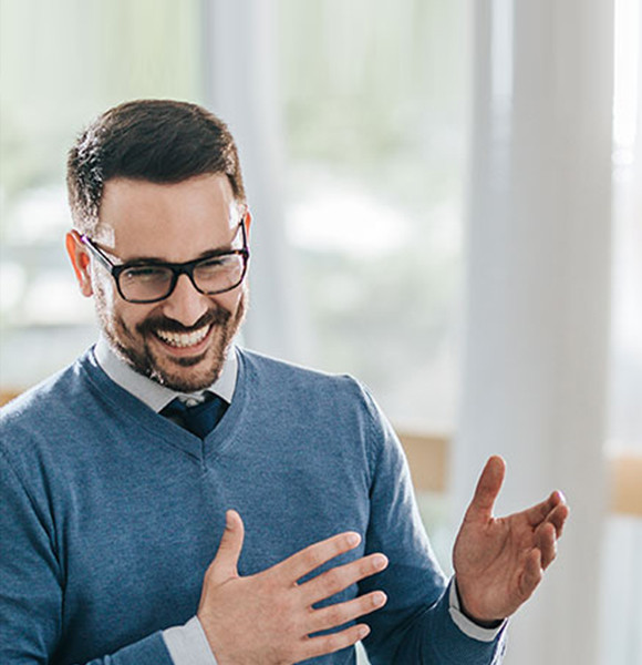 man standing in discussion with colleague