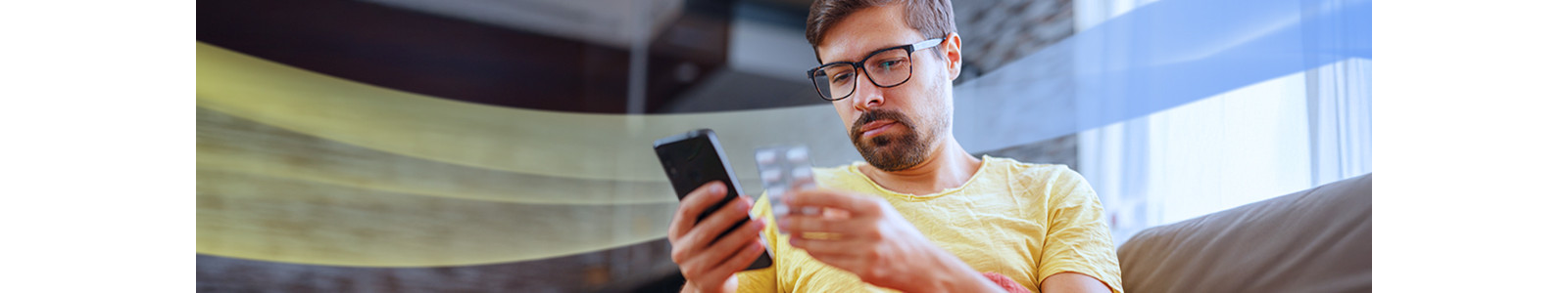A man is checking the medicine on his phone