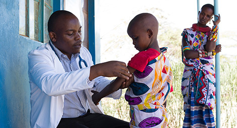a doctor taking care of a child