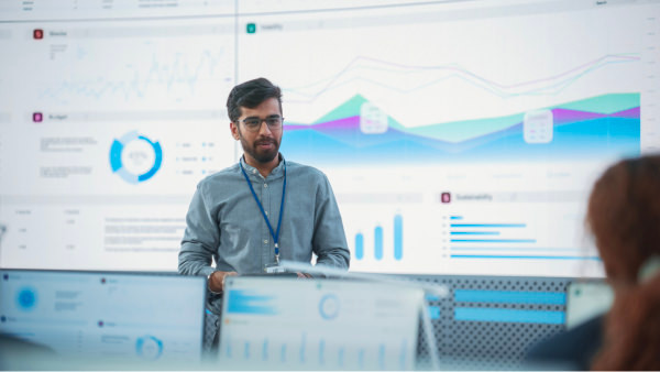 man giving a presentation in a classroom environment