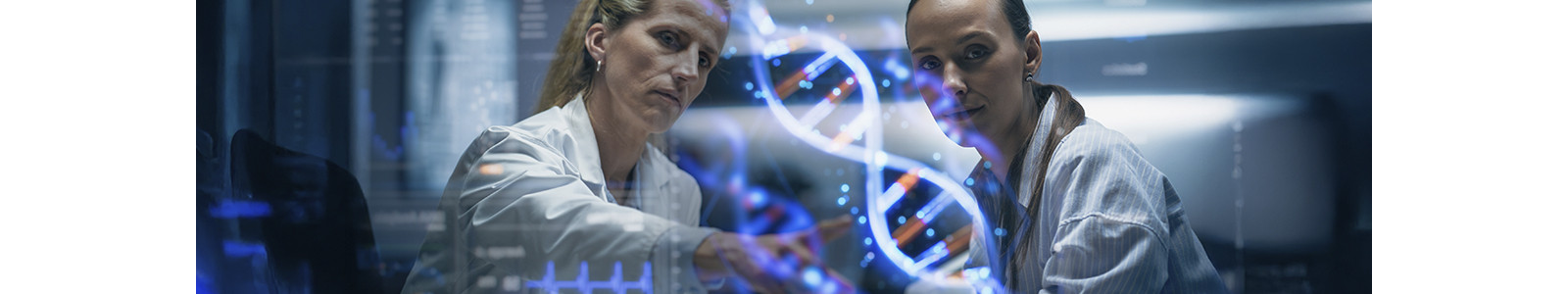 Two scientists in lab coats examine a DNA structure model in a laboratory setting.