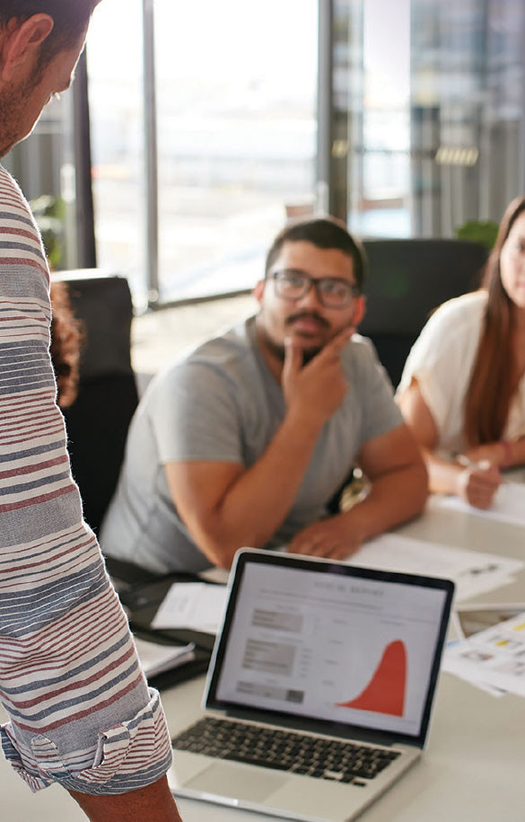 group of associates working around a conference table