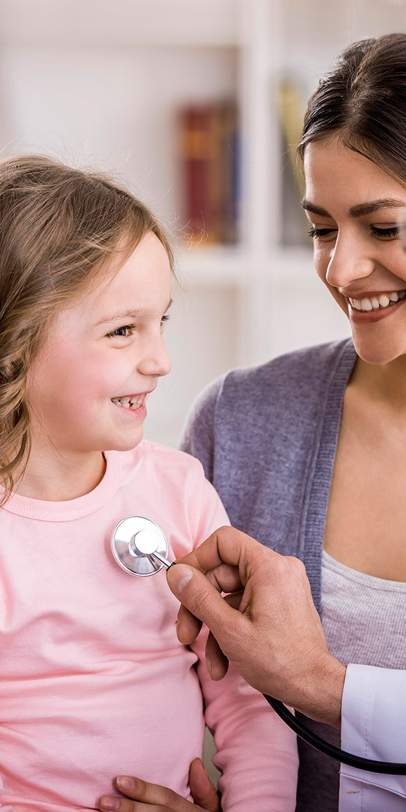 Young girl smiling as stepscope is held over her heart