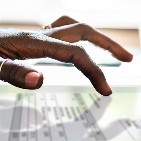 someone's fingers on a screen