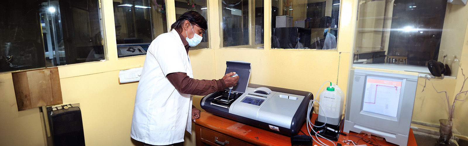 medical researcher testing something using a machine