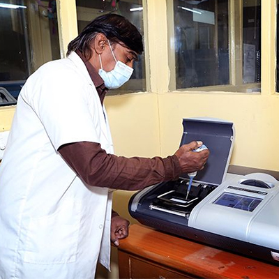 medical researcher testing something using a machine