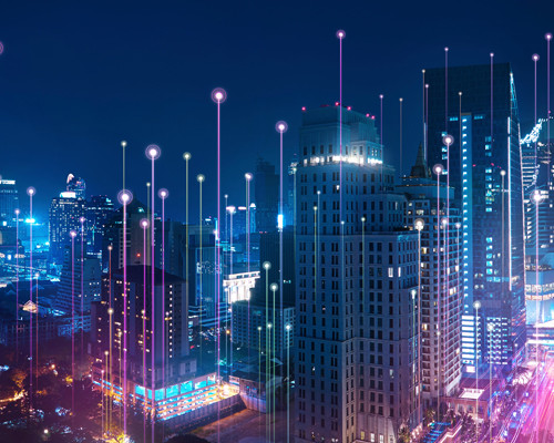 Digital image of city landscape with tall buildings at night