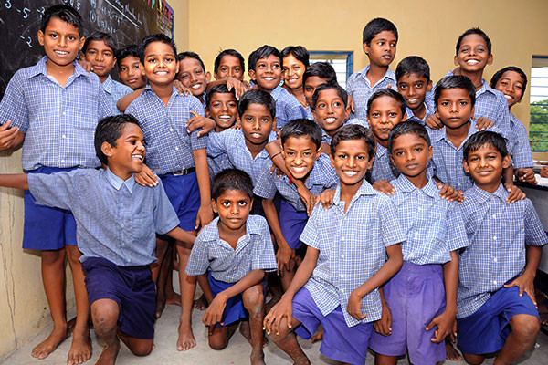 Children in school uniform smiling