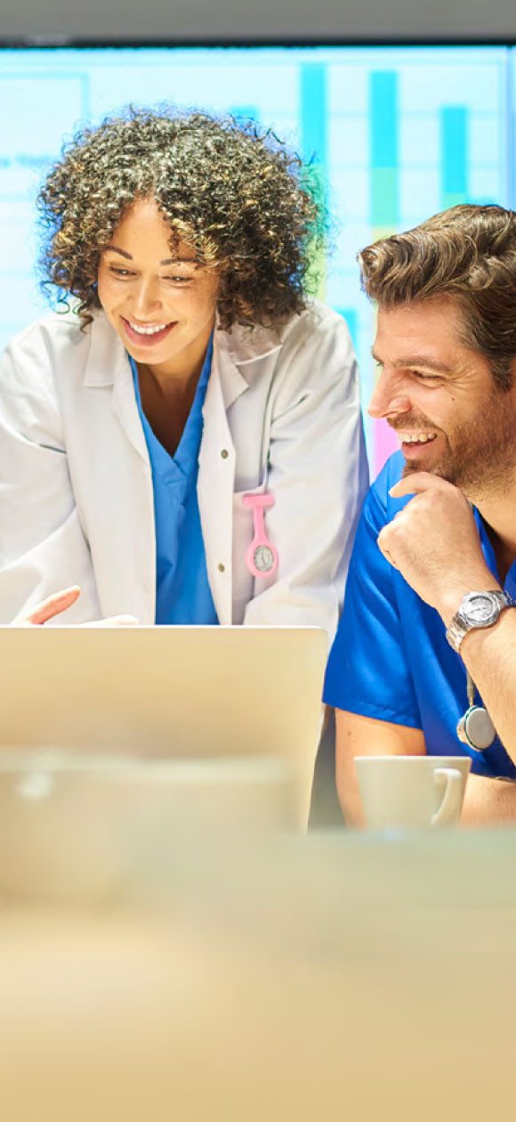 Doctors smile during meeting