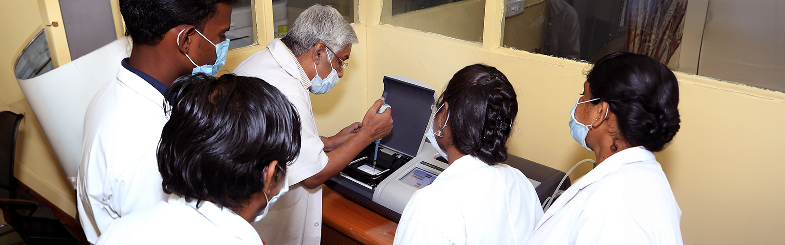 Group of doctors testing a sample