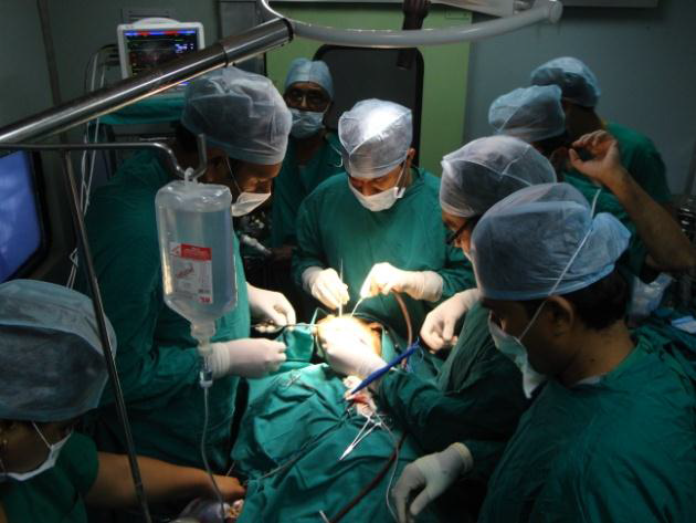 Surgeons operating a person