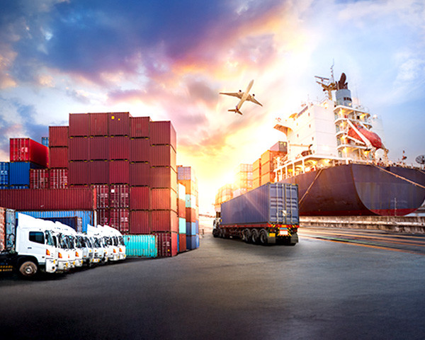 A large cargo ship is docked at the port, loaded with containers and ready for its next journey.