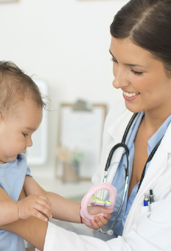 Female doctor smiling at baby