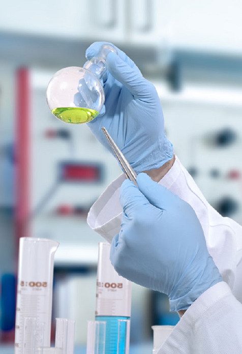 Technician holding sample in a lab