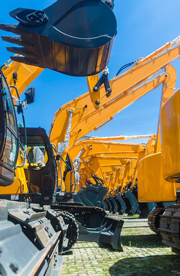 Series of backhoes ready to excuvate