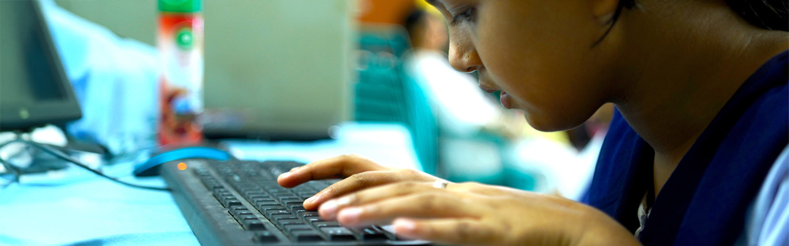 Visually children typing on keyboard