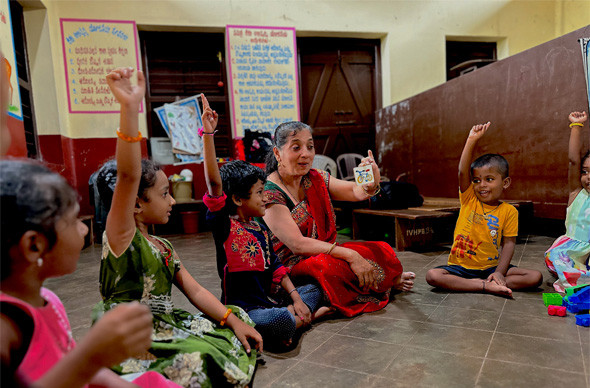 A facilitator with children with special needs in an early intervention center