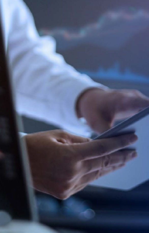 A set of hands holding tablet device