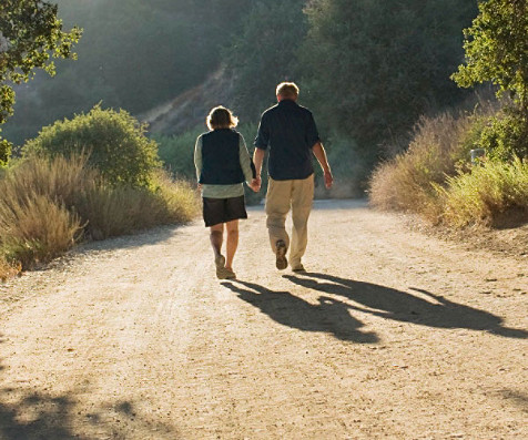 old man and woman walking