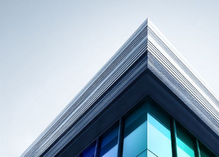 Low-angle view of a modern glass building