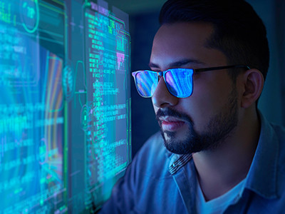 A man seeing a computer screen very closely