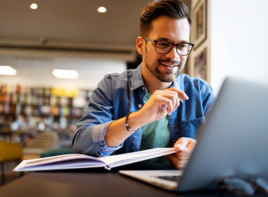 man looking at laptop